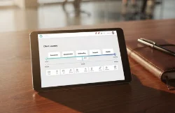 Tablet on a table showing a flow of a client journey and pipeline management held within a CRM