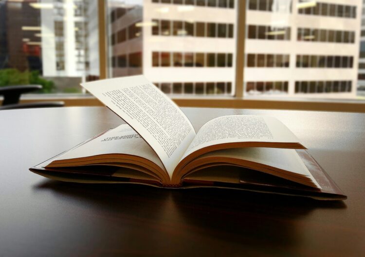 Picture of an open book on a table